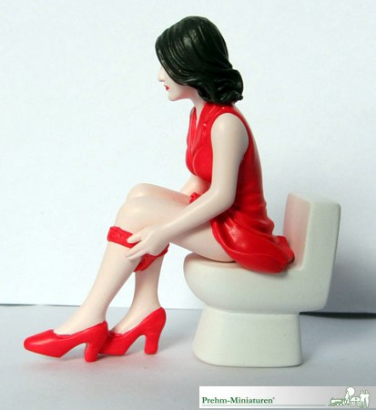 Frau auf Toilette 